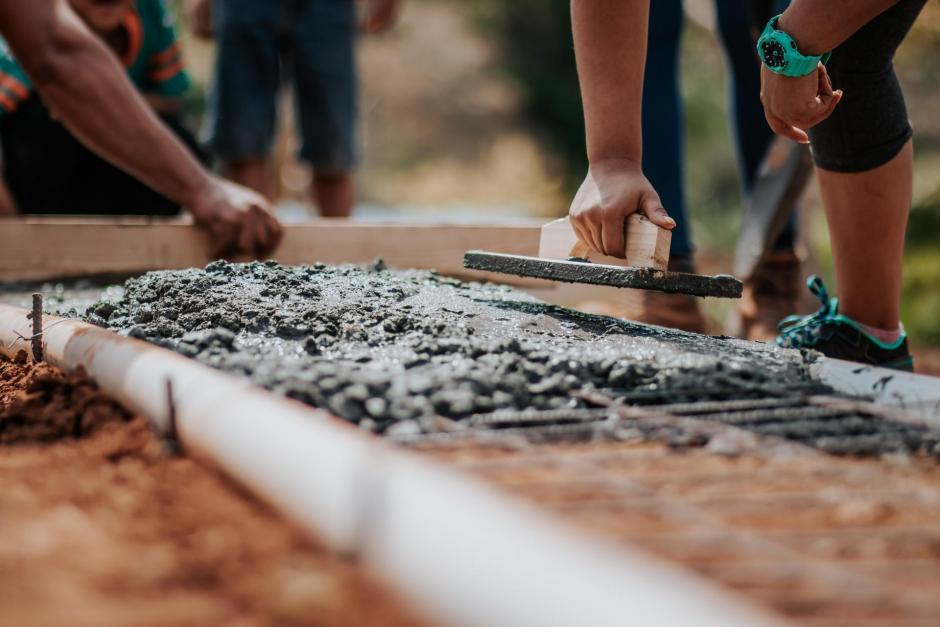 Putting down concrete with a trowel